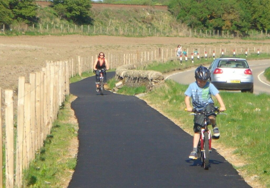 An image of a road with cyclists