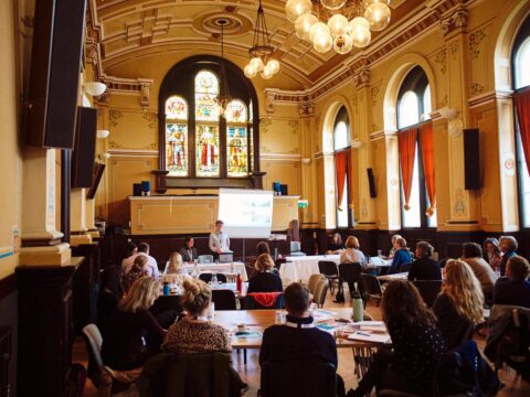 People listening to a person speaking