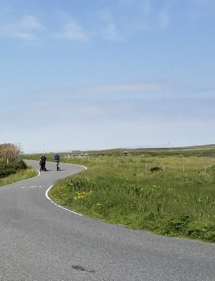 Image showing winding rural single track road with people walking and cycling